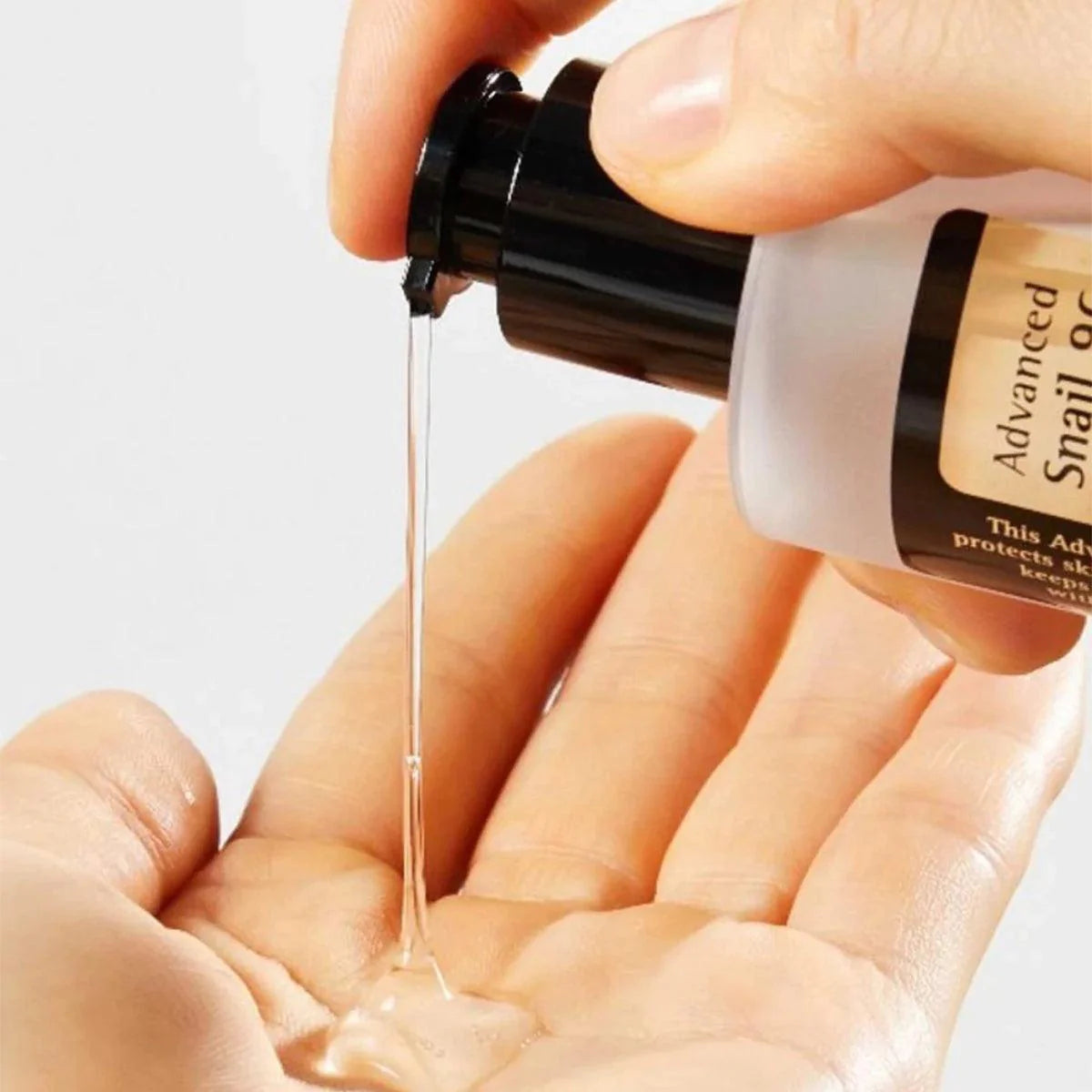 Lightweight, viscous texture of COSRX Snail 96 Power Essence – Fast-absorbing Korean hydrating essence for a dewy "Glass Skin" finish at Atelier De Glow UK.