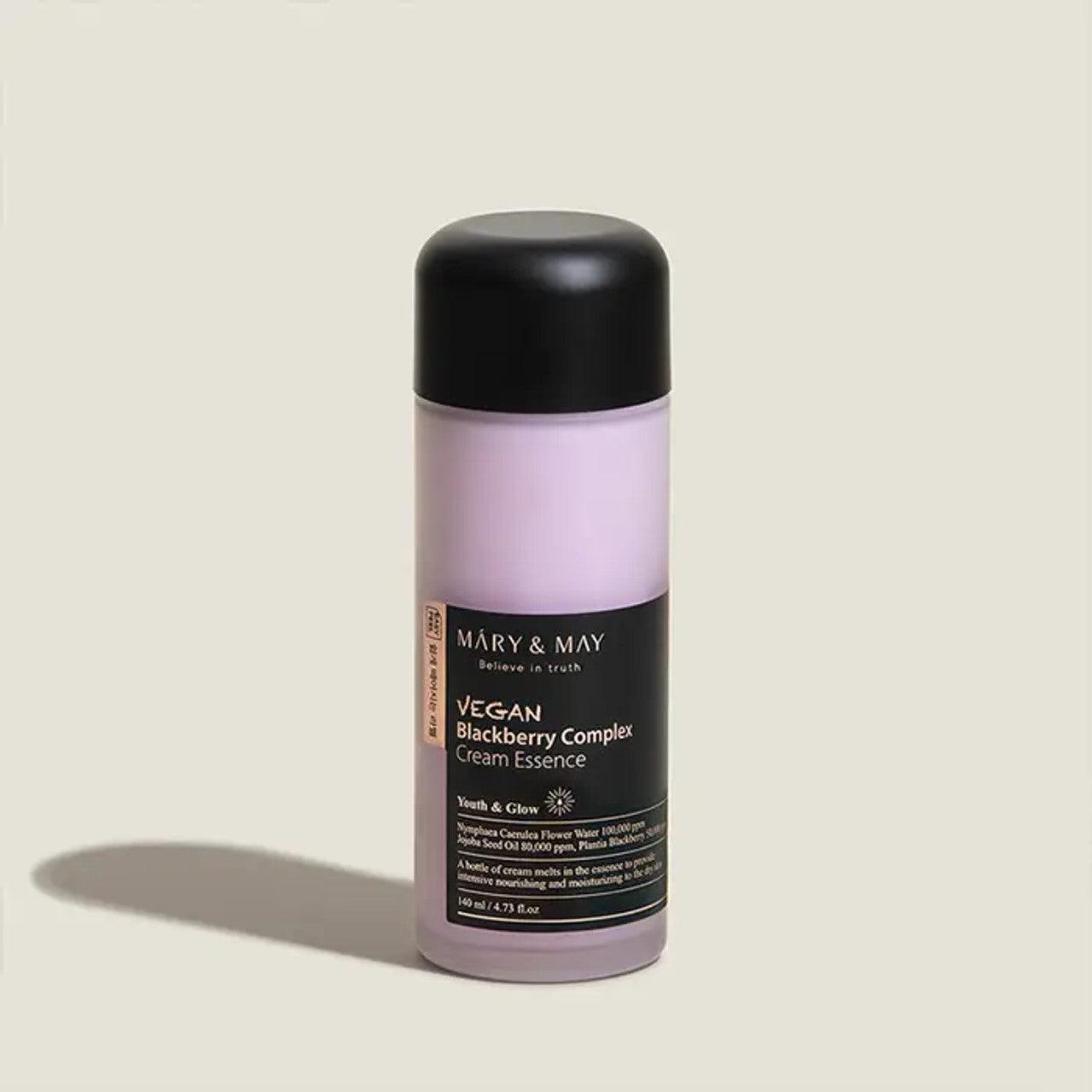 Rich, milky-white blended lotion-essence texture of Mary & May Blackberry Complex melting instantly into a parched skin canvas at Atelier De Glow UK.
