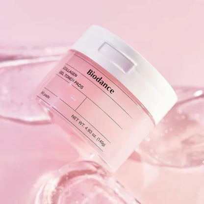 Soft, essence-coated jelly fabric texture of Biodance Collagen Gel Toner Pads being lifted with tweezers from their jar at Atelier De Glow UK.