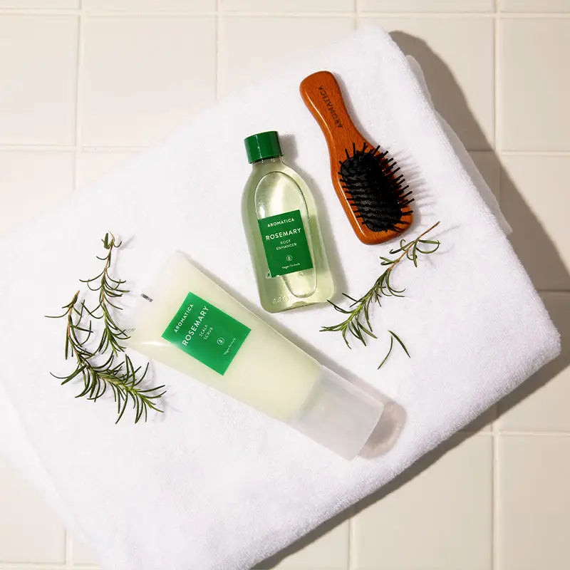 Botanical, refreshing essential oil textures of Aromatica Rosemary Scalp Scaling Trial Kit being applied to sectioned hair roots at Atelier De Glow UK.