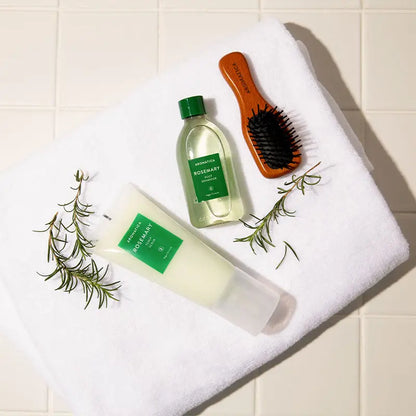 Botanical, refreshing essential oil textures of Aromatica Rosemary Scalp Scaling Trial Kit being applied to sectioned hair roots at Atelier De Glow UK.