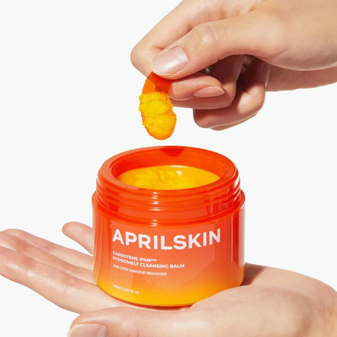 Yellow sorbet texture of APRILSKIN Hydramelt Cleansing Balm – Emulsifying Korean oil-to-milk cleanser for a smooth "Glass Skin" base at Atelier De Glow UK.