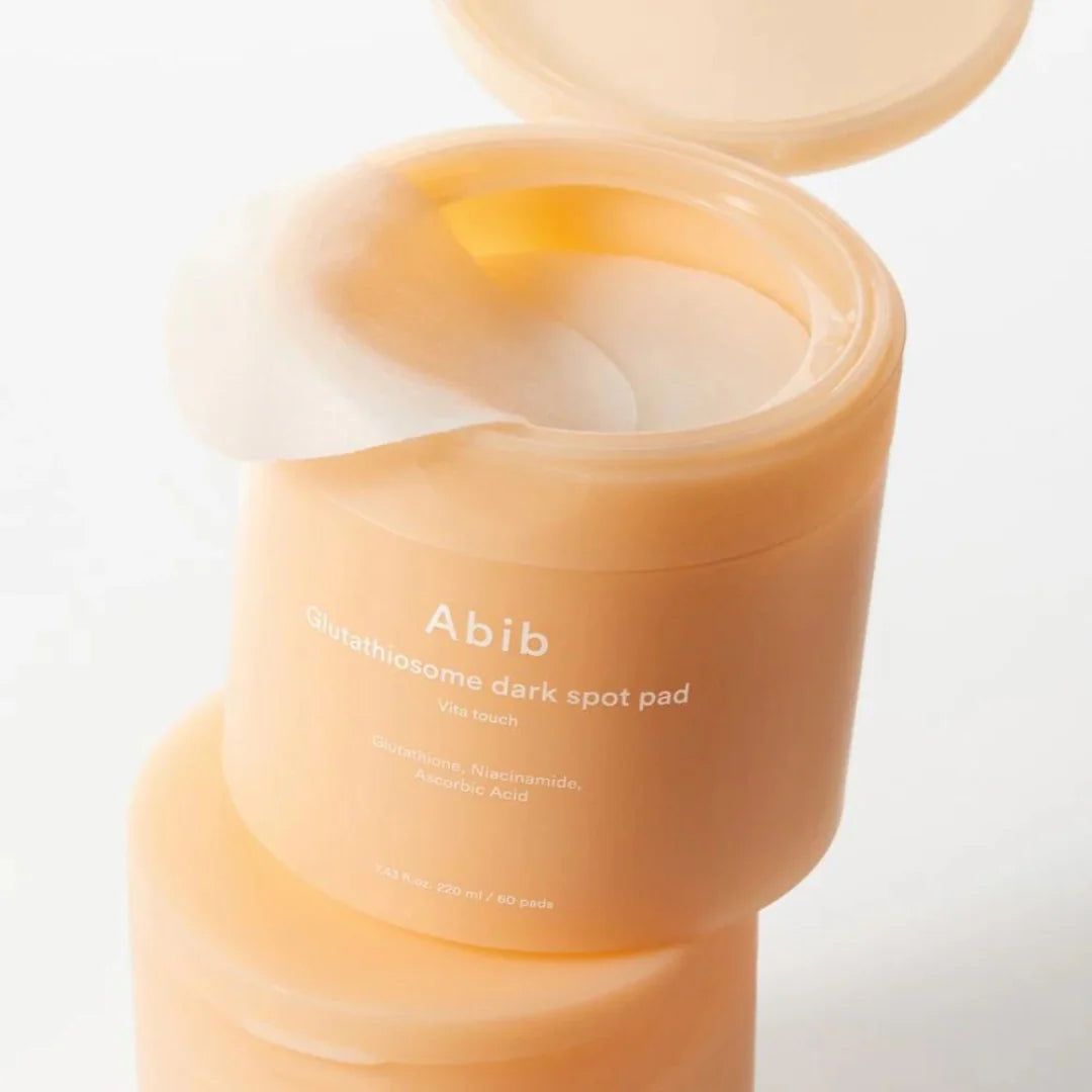 Applying Abib Dark Spot Pad as a targeted cheek mask - K-beauty Glutathione treatment - Atelier De Glow UK