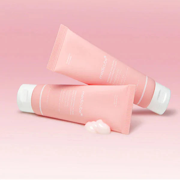Cushion-soft, water-burst, and pastel pink gel-cream texture of Medicube PDRN Pink Hyaluronic Moisturizing Cream melting into a skin barrier at Atelier De Glow UK.