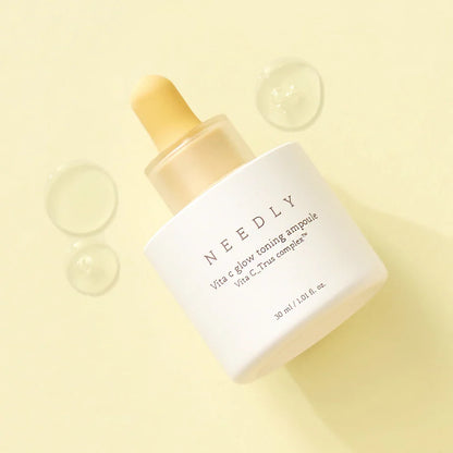 Needly Vita C Glow Toning Ampoule – target dark spots, uneven tone, and dehydration with this hypoallergenic fruit-extract infused serum from Atelier De Glow UK.
