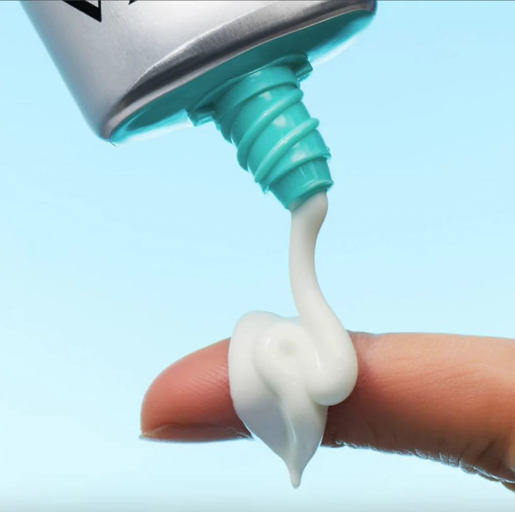 Whipped, airy, and completely translucent clear liquid cream texture of VT Air Cloud Sunscreen absorbing instantly into the skin at Atelier De Glow UK.