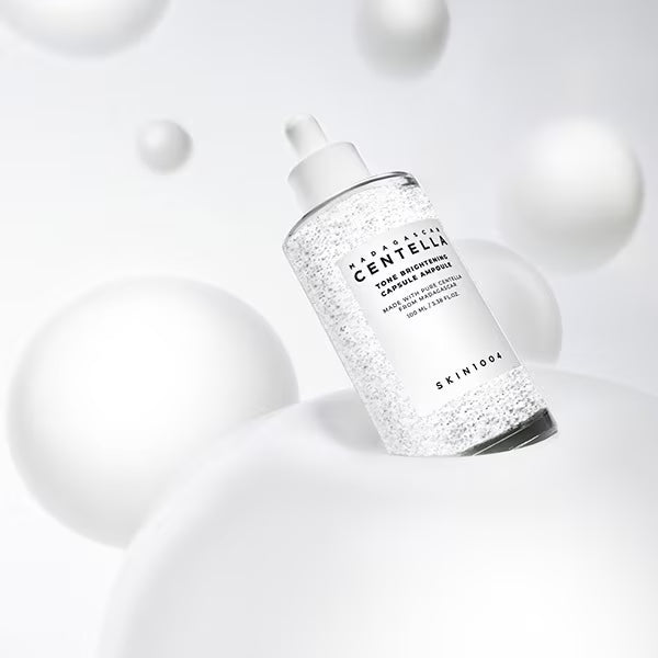 SKIN1004 Madagascar Centella Tone Brightening Capsule Ampoule for evening out skin tone, fading acne marks, and revitalizing dull complexions from Atelier De Glow UK.