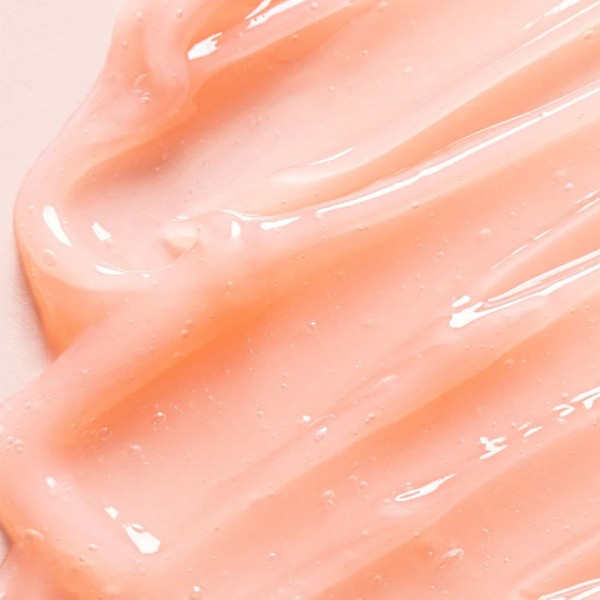 Rich, glossy, and beautifully translucent pink-tinted glazed balm texture of TOCOBO Vita Lip Mask melting onto chapped lips at Atelier De Glow UK.
